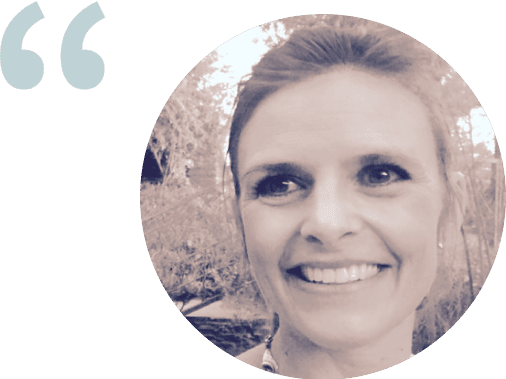 Photo of Tracy Heverly, a smiling Caucasian woman with her hair pulled back. 