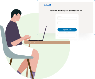 An individual with earphones on creating a LinkedIn page on their laptop.
